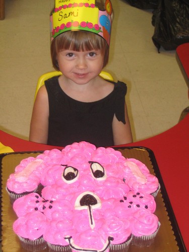 Sami with pink birthday cupcakes
